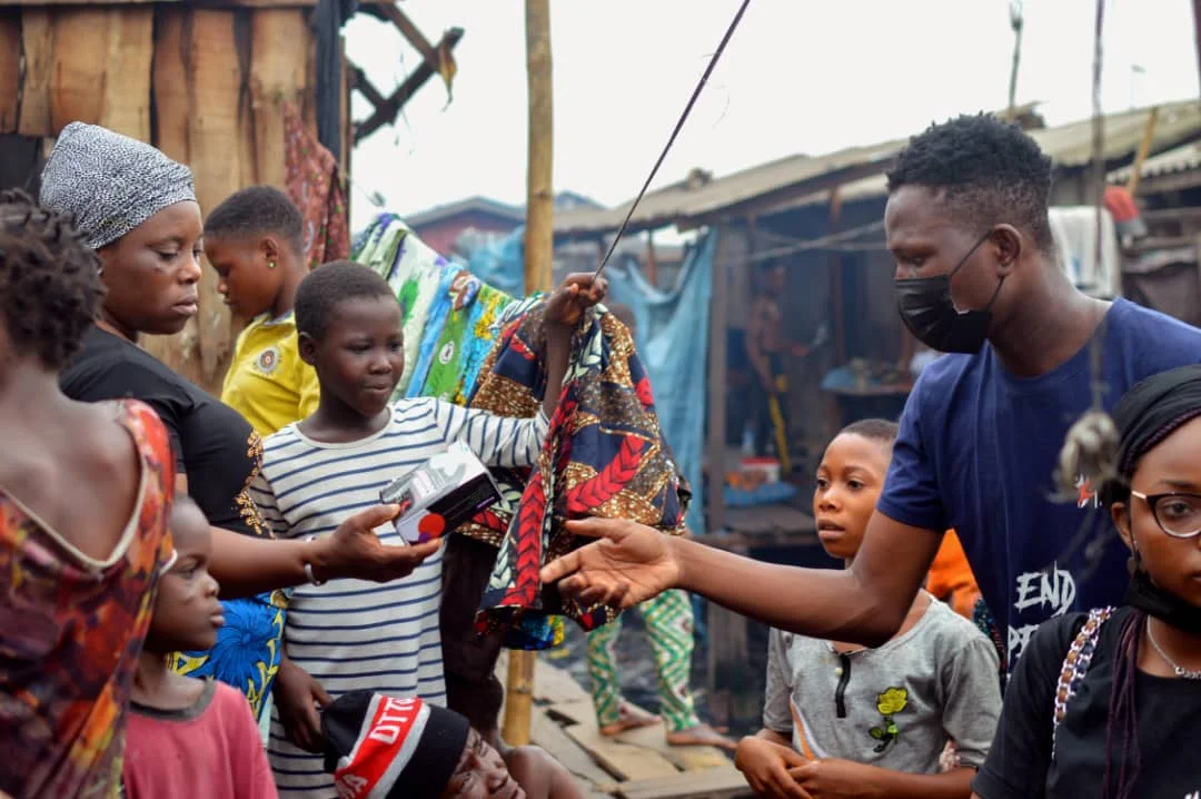 An image of RMF distributing pads on project End Period Poverty